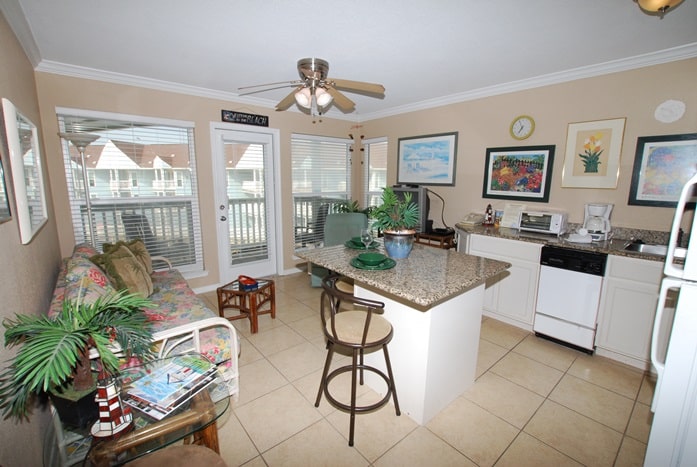 Photo of living room and kitchen area with windows at Seascape Condominiums