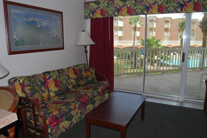 Photo of living room and balcony through window at Victorian Condominiums