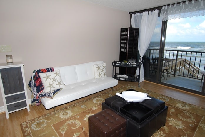 Photo of living room with view of Gulf at West Beach Grand Condominiums