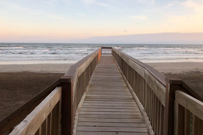 Photo of dune walkover and beach at sunset at Riviera II Condominiums