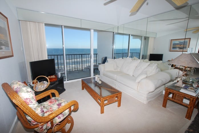 Photo of living room with balcony overlooking the Gulf at Riviera I Condominiums