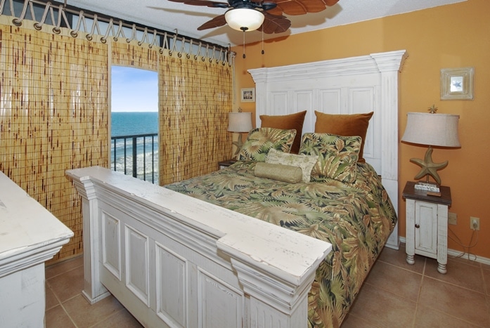 Photo of bedroom with Tiki decor overlooking Gulf of Mexico at Riviera I Condominiums