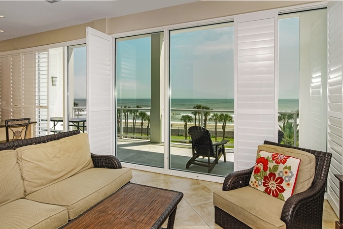 View of Gulf of Mexico through living room windows at Diamond Beach Condominiums