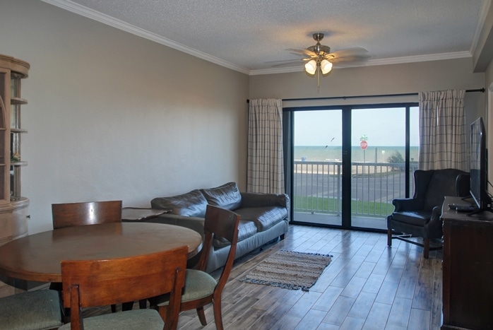 Living room and Gulf view of featured listing at Breakers Condominiums