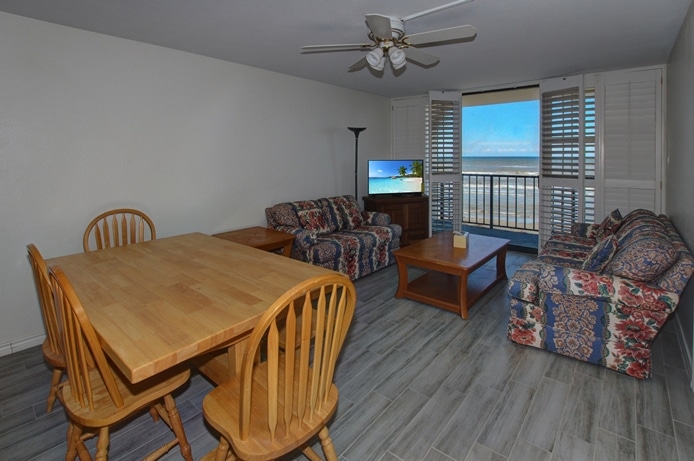 Living and dining space with views of Gulf of Mexico at Riviera I Condominiums