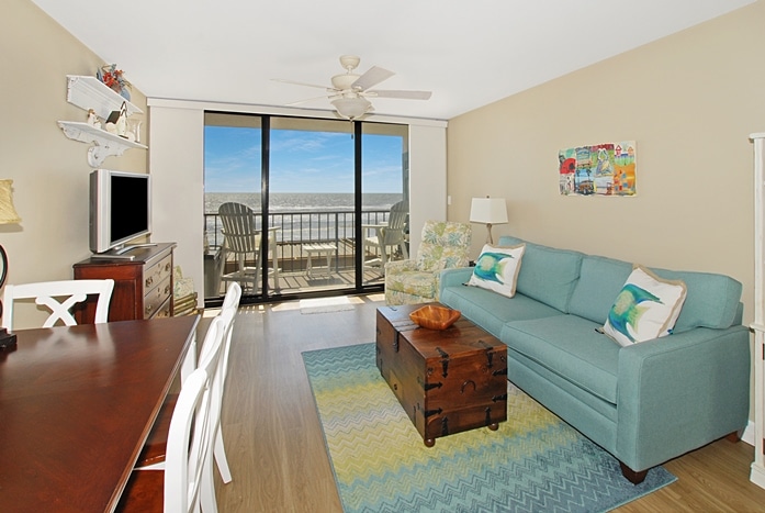 Photo of living room with view of Gulf from West Beach Grand Condominiums