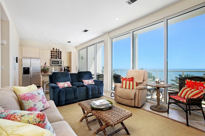 Photo of living room with wall of windows overlooking Gulf at Diamond Beach Condominiums