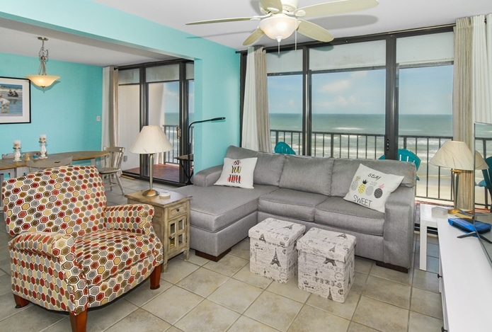 Photo of living room and dining room with views of Gulf at West Beach Grand Condominiums