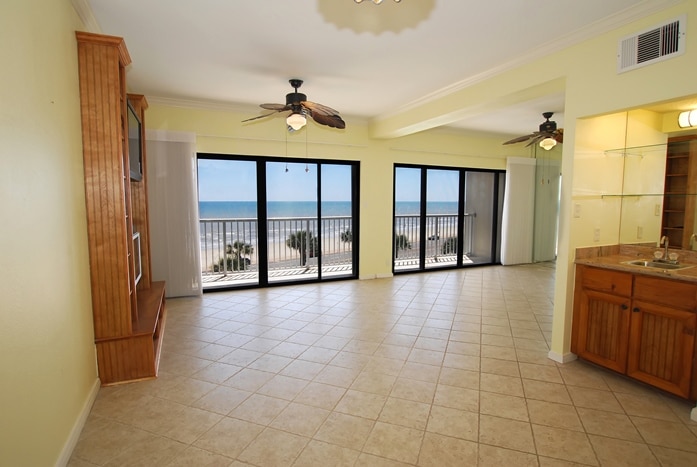 Photo of living room with windows looking out to Gulf