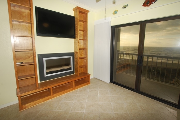 Photo of built-ins in living room with view of Gulf at Breakers Condominiums