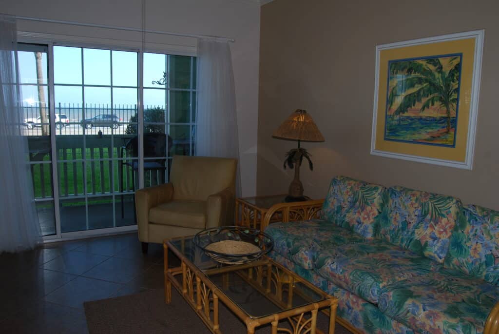 Photo of living room with view of patio at Dawn Condominiums