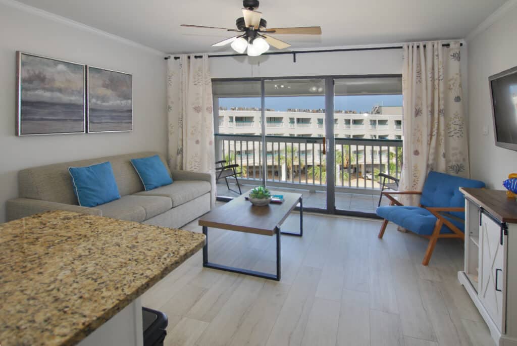 Photo of living room with view of outside through window at Casa Del Mar Condominiums