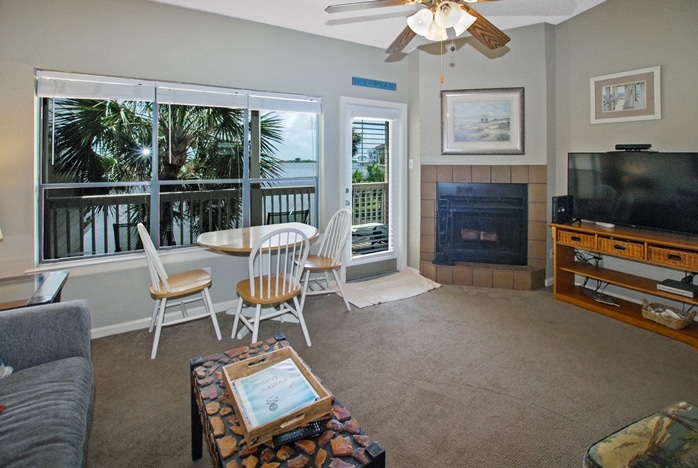 Photo of living room with view of lake at Pirates Cove Townhomes