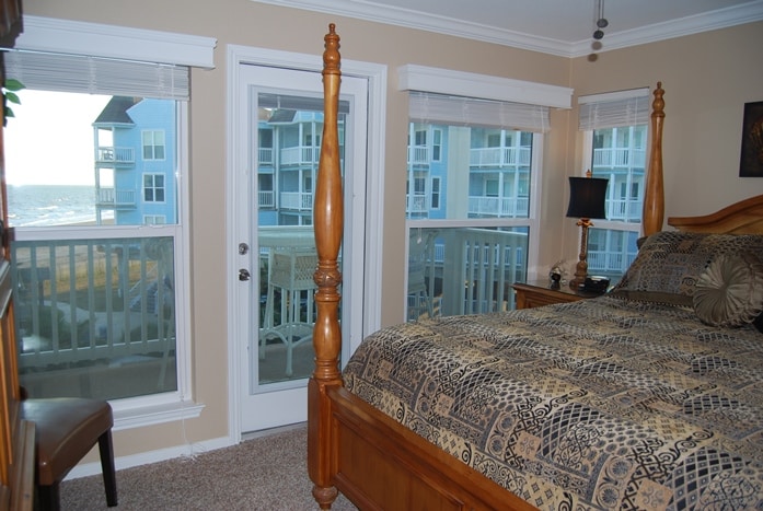 Photo of bedroom with views of Gulf through the windows at Seascape Condominiums