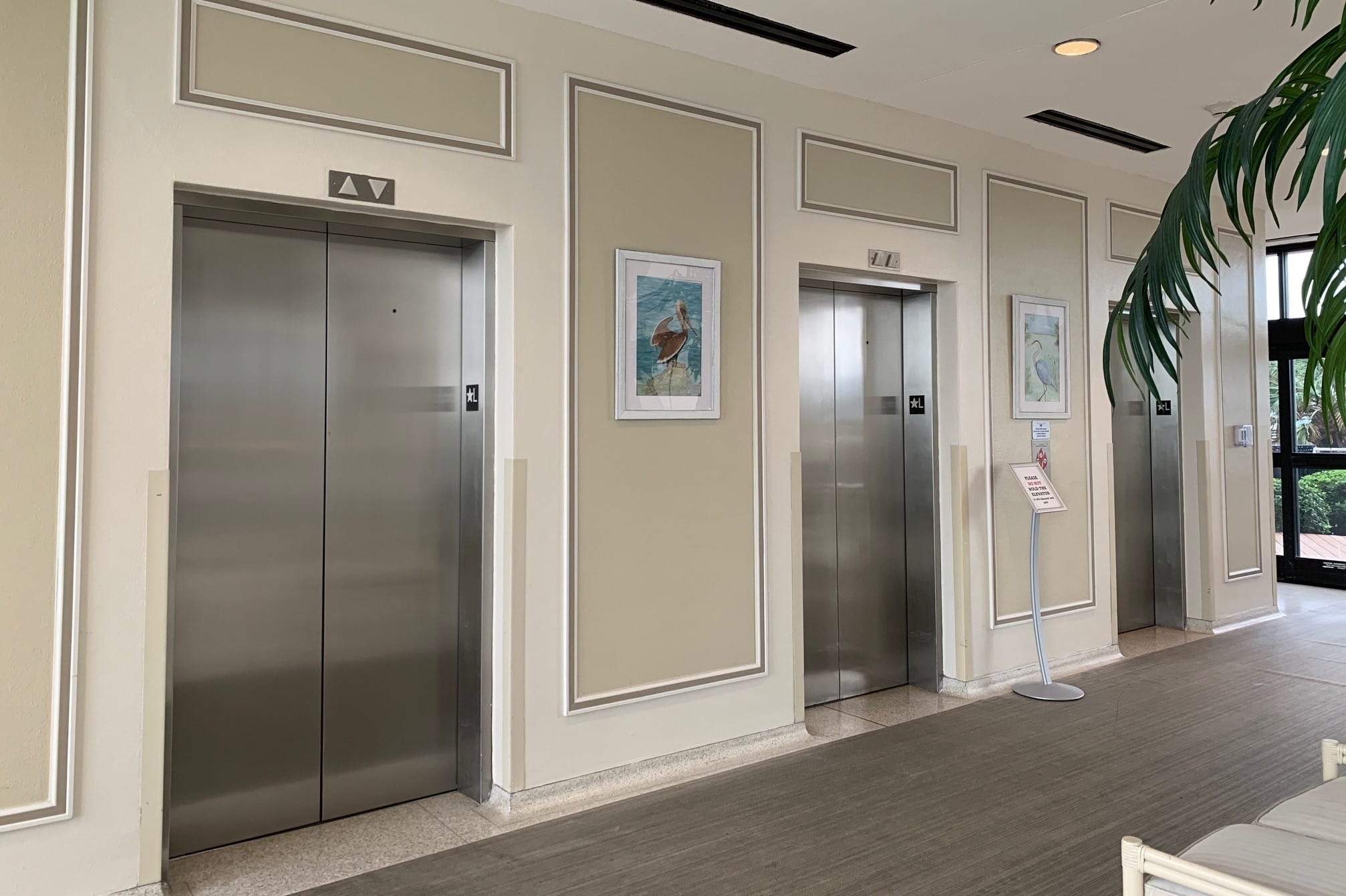 Photo of three elevators in Galvestonian Condominiums