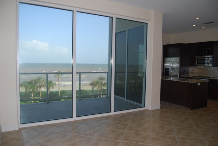 Photo of living room with view of balcony and Gulf at Diamond Beach Condominiums