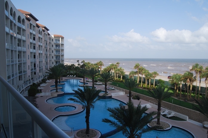 Photo of pool and back of building at Diamond Beach Condominiums