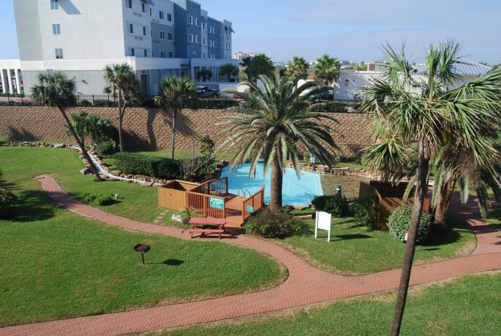 Photo of swimming pool from balcony at Maravilla Condominiums