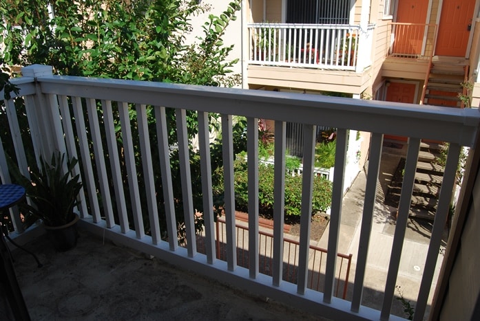 Photo of balcony railing and grounds at Palms At Cove View Condominiums