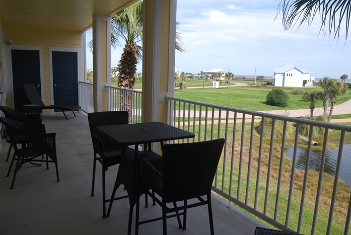 Photo of balcony with furniture and views of Gulf at Pointe West Condominiums