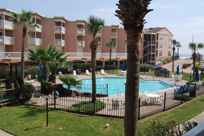 Photo of swimming pool view from balcony at Victorian Condominiums.