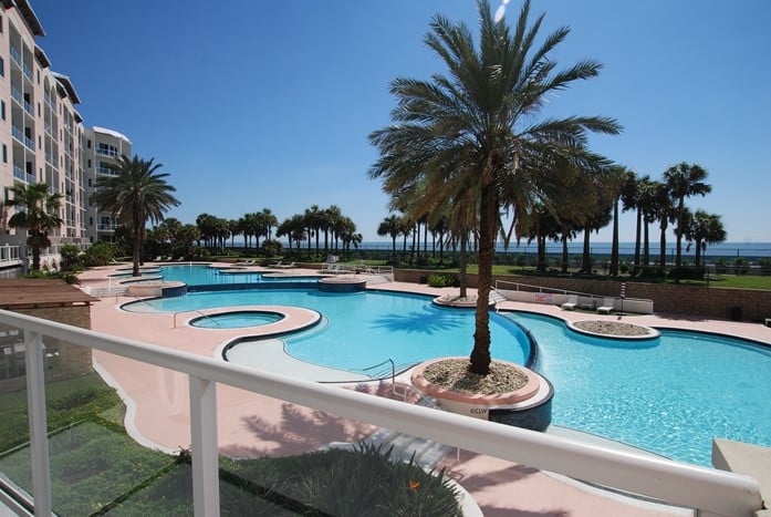 Photo of swimming pool from second floor balcony at Diamond Beach Condominiums