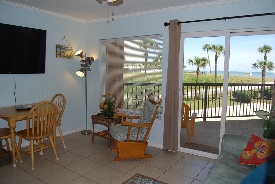 Photo of living room with view of balcony and Gulf from Maravilla Condominiums