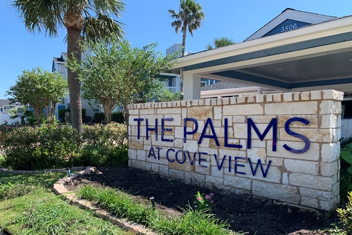 Photo of entrance sign at Palms At Cove View Condominiums