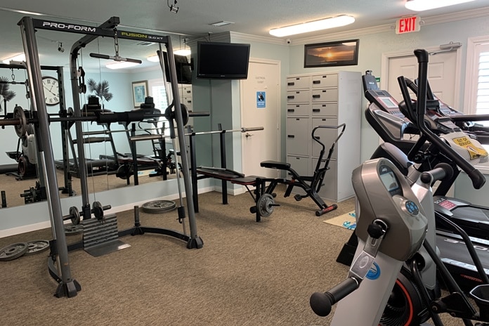 Photo of fitness center with exercise equipment at Palms At Cove View Condominiums