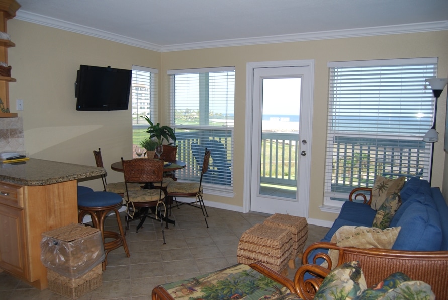 Photo of living room with view through windows at Seascape Condominiums