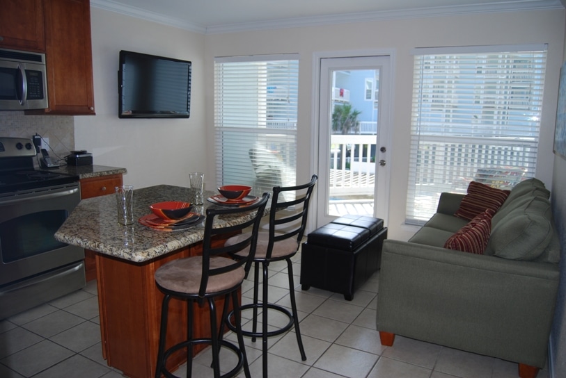 Photo of living area with windows overlooking balcony at Seascape Condominiums