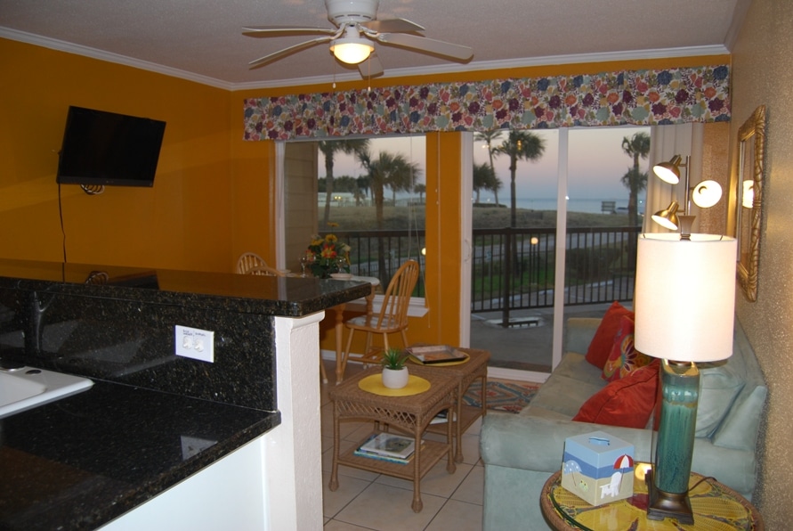 Photo of living room with balcony and Gulf views at Maravilla Condominiums