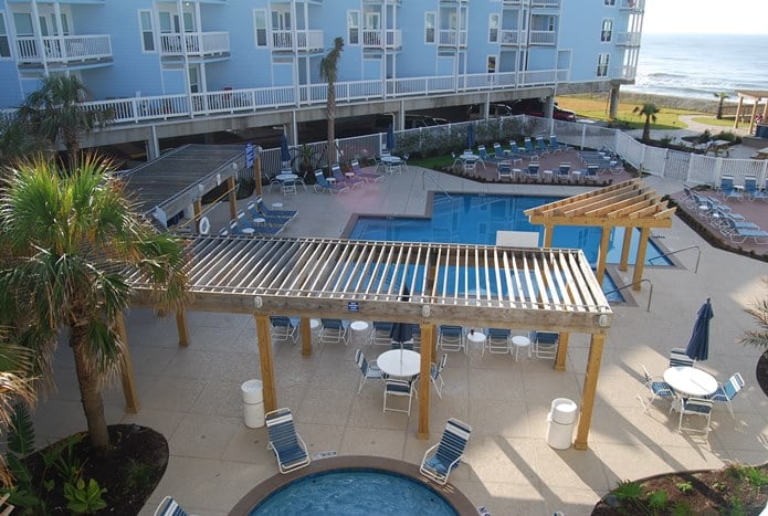 View of pool area from balcony at Seascape Condominiums