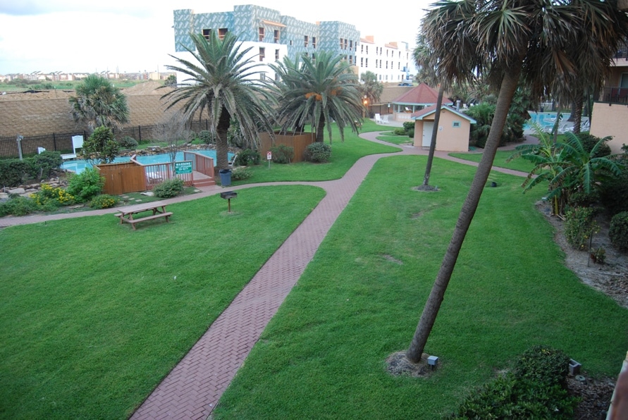 Photo of exterior green space from balcony at Maravilla Condominiums