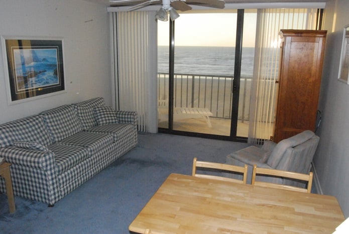 Photo of living room with view through windows at West Beach Grand Condominiums