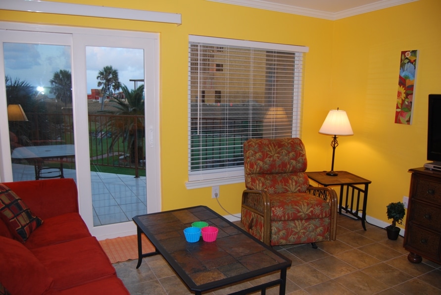 Photo of living room with view through windows at Maravilla Condominiums