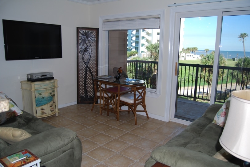 Photo of living area with view of balcony through window at Maravilla Condominiums