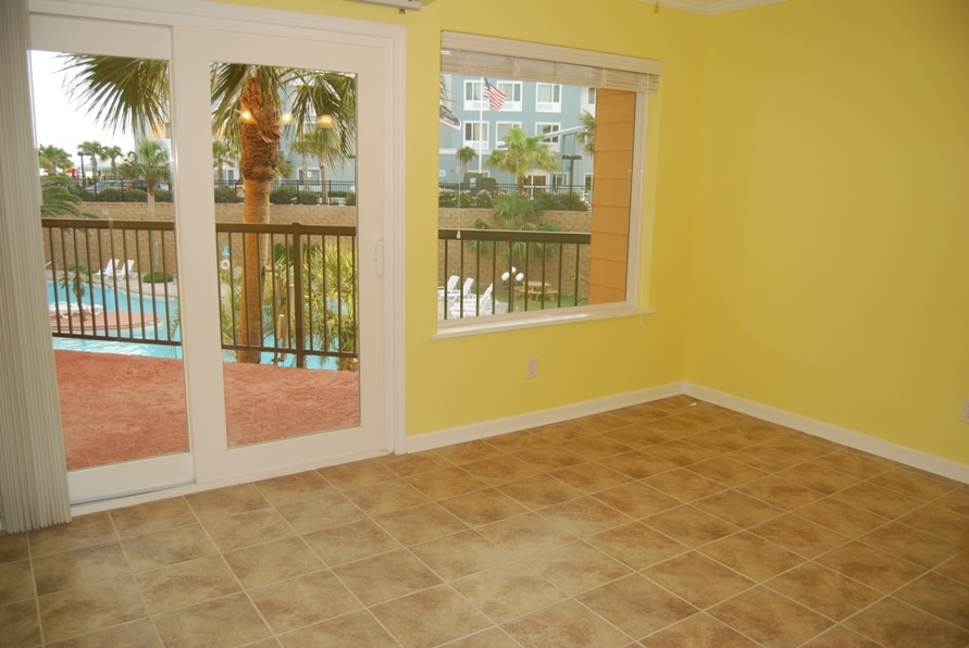 Photo of living room with view of balcony through window at Maravilla Condominiums