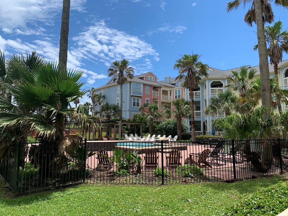 Photo of east pool area from patio of Dawn Condominiums